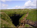 Cave and railway viaduct at Long Slough