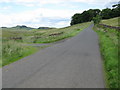 NY7467 : Minor Road leading to the Steel Rigg Car Park and Viewpoint by G Laird