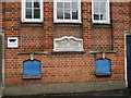 Plaque under the window