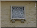 Detail of the wall plaque on the Calne almshouses