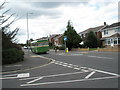 Vintage bus passing the junction of South Close and Jellicoe Avenue