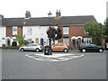 Unusual triangular roundabout in Village Road