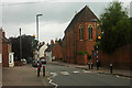 Main Street Abbots Bromley beneath gathering rain clouds