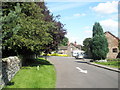 One way road going past the parish church at Ditton Priors