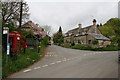 Bus stop & phone box in Woodmancote