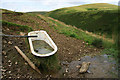 An old bath in a field