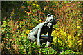 Bronze figure among ferns -  Museum of Welsh Life, St Fagans