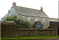 SW8976 : Farmhouse at Porthmissen from south by Andy F