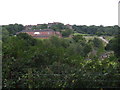 View across hedge to Ardingly College and College Farm