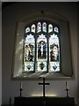 Stained glass window above the altar at St Peter, Bishop