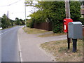 TM3977 : B1123 Holton Road & Holton Road Postbox by Geographer