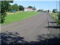 Uphill to houses by Langmuirhead Road