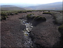 NO4767 : Eroded peat above Mowat's Seat by Mike Dunn