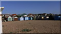 Beach huts around three sides of a square