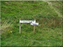 NR6707 : Sign posts to St Columba's Well & footprints and Keil Caves by PAUL FARMER