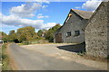 Roadside farm buildings in Weald