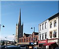 A Row of Shops and the Spire of St Mary