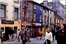 M2925 : Galway - William Street shops & shoppers by Joseph Mischyshyn