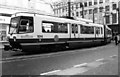 Manchester Metrolink tram 1014 turning from Market Street into Mosley Street