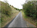 View south along minor road near Peene