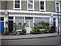 Flowers outside converted shop in Ifield Road