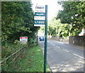 Bilingual bus stop sign - English side