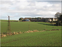 NY8663 : Farmland and wind pump west of East Elrington by Mike Quinn