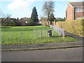 Road and path junction by the recreation ground in Redwing Road