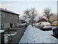 Mid section of a snowy Dormington Road