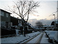 Looking down a snowy Dormington Road towards Ludlow Road