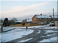 Snowy scene at the staggered crossroads of Dormington Road, Mortimer Road and Cinderford Close