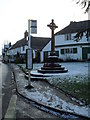 Bus stop by the war memorial in Shalford village centre