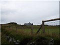 Cliff top farmhouse above Lignaballogy cove