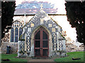 TF7105 : St Andrew's church - elaborate flushwork decoration on south porch by Evelyn Simak