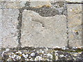 Scratch or mass dial on church porch