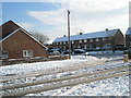 Approaching the junction of  a snowy Park House Farm Way and Purbrook Way