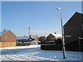 Looking from Grtaeley Crescent across a snowy Linkenholt Way towards Colbury Grove