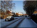 Approaching the junction of  a snowy Awbridge Road and Winchfield Crescent