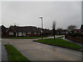 Junction of a snowy Parry Drive and Kirkland Close