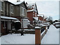 A snowy pavement in Grove Road