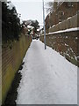 A snowy cut through from Juniper Square to  Grove Road