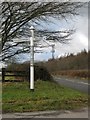 Communications mast above the road at Webbery Moor Cross