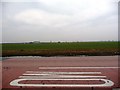 Flat, hedge-less field, between the A614 and the M62