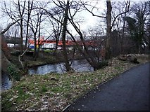 NT2170 : Water of Leith Walkway, with Booker's orange warehouse behind the trees by Christine Johnstone