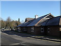 Looking along the access road from Tesco