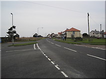 NU2329 : Road to Beadnell Harbour by Les Hull