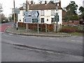 Various road signs hiding the Selsey Arms