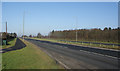 Square Wood on the right and a cycle lane by the Rainford By-Pass