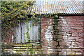 Wood, stone and corrugated iron