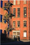 SJ9856 : Mill with cast iron fire escape by David Lally